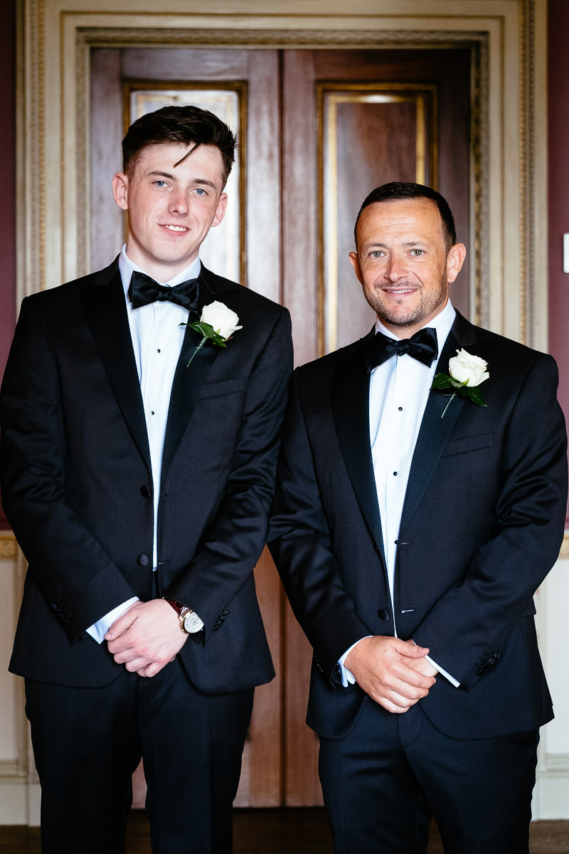 The groom and best man pose together in tuxedos before the ceremony at Carton House.