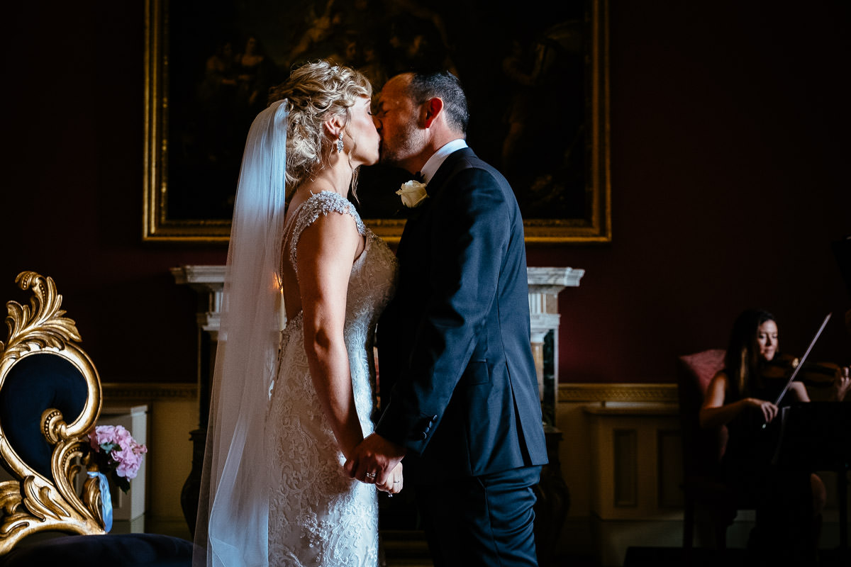 The bride and groom share their first kiss as newlyweds at Carton House.
