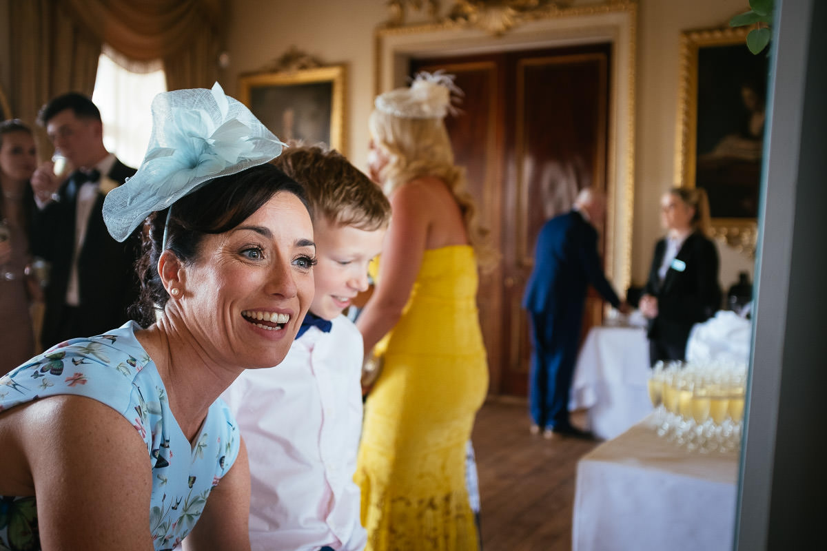 Guests laugh together during the drinks reception at Carton House.