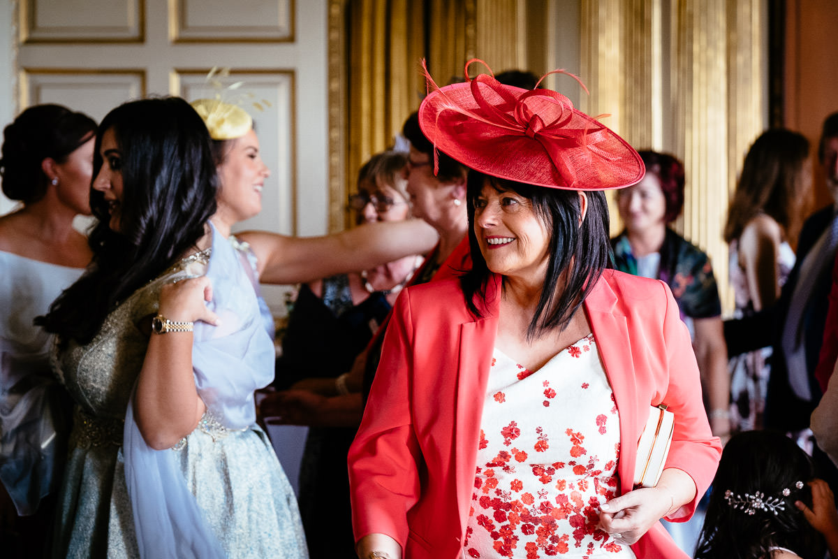 Guests in colourful hats and dresses mingle during the drinks reception at Carton House.