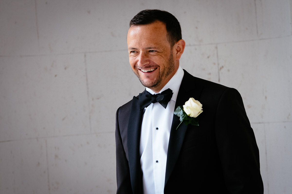 groom laughing at their carton house wedding in Maynooth