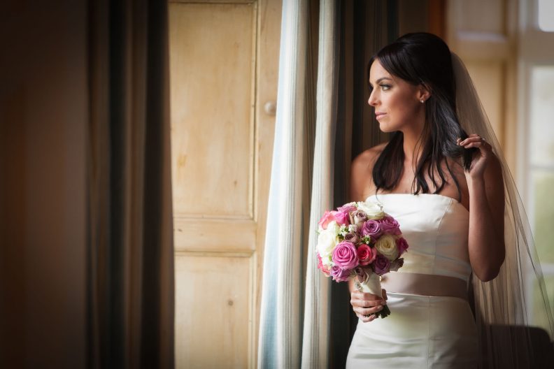 bride at a window in luttrellstown castle