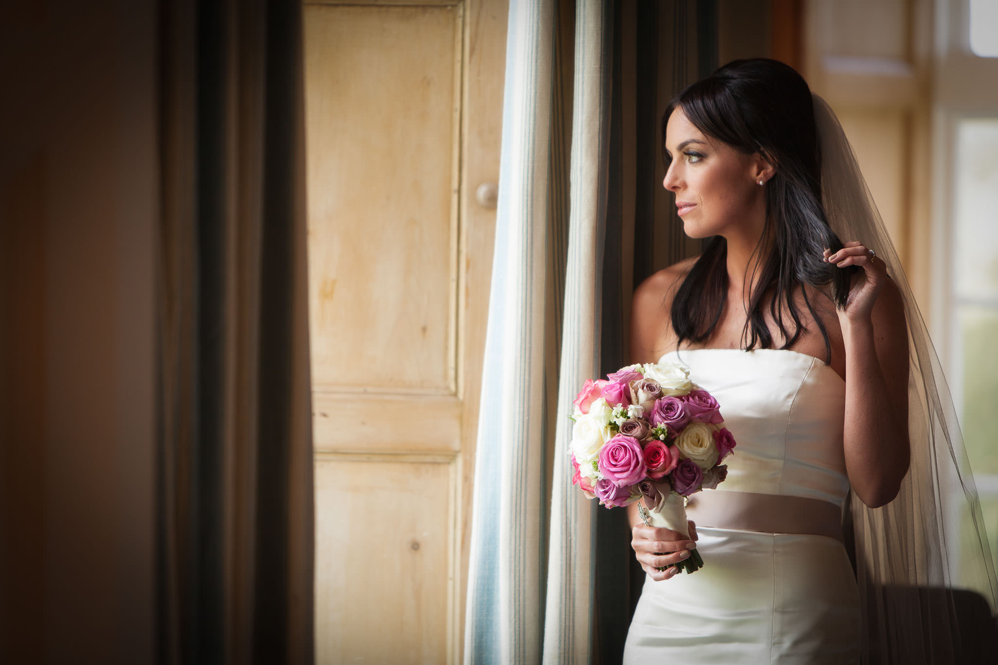 bride at a window in luttrellstown castle