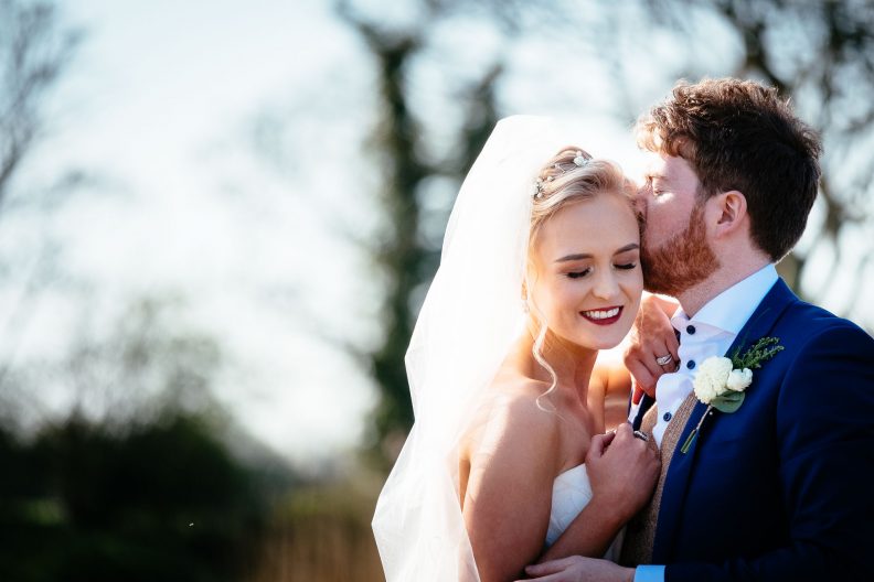 Beautiful Ballymagarvey Village Wedding 3 bride and groom embracing at their ballymagarvey village wedding
