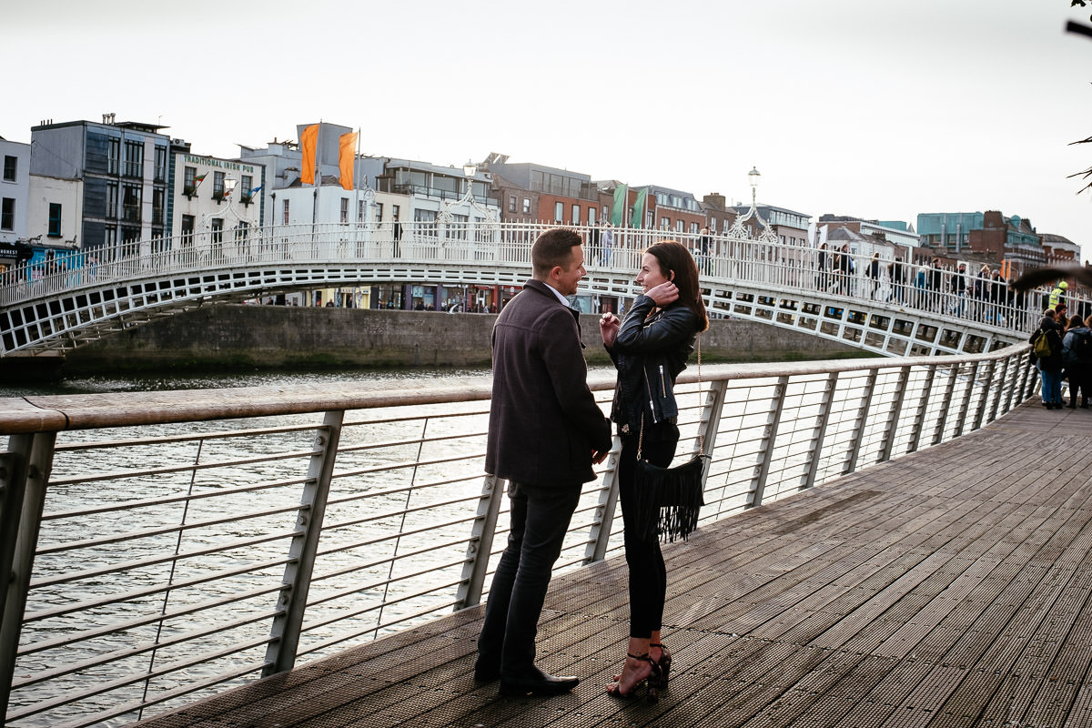 guy about to propose by the river liffey boardwalk in dublin