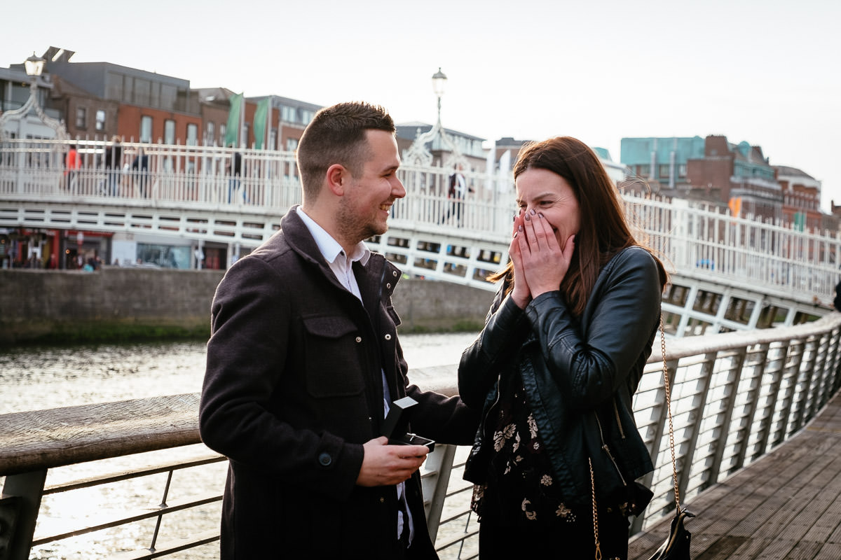 guy who just proposed to his girlfriend by the river liffey boardwalk in dublin
