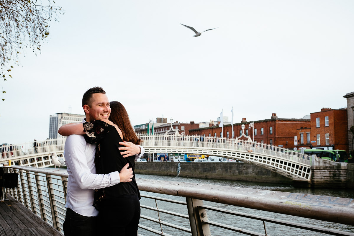 newly engaged couple by the ha'penny bridge in dublin