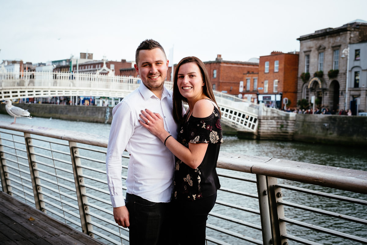newly engaged couple by the ha'penny bridge in dublin