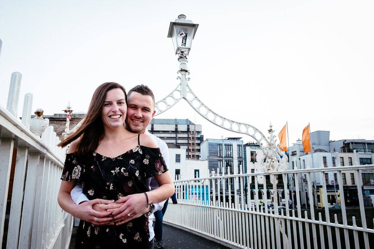 newly engaged couple on the ha'penny bridge in dublin