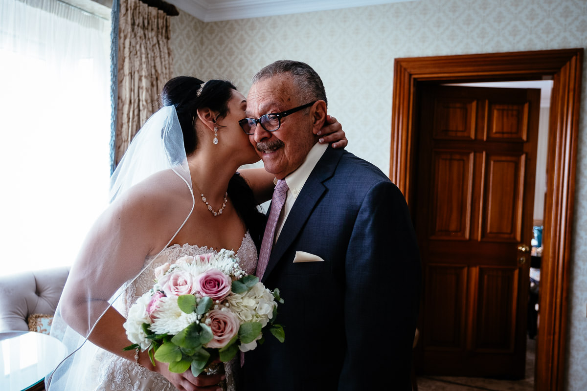 bride kissing her elderly father at glenlo abbey hotel wedding