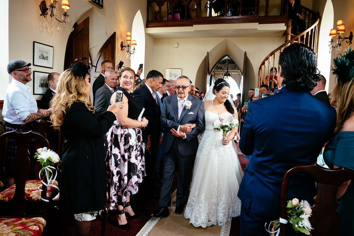 bride walking up aisle at glenlo abbey hotel wedding