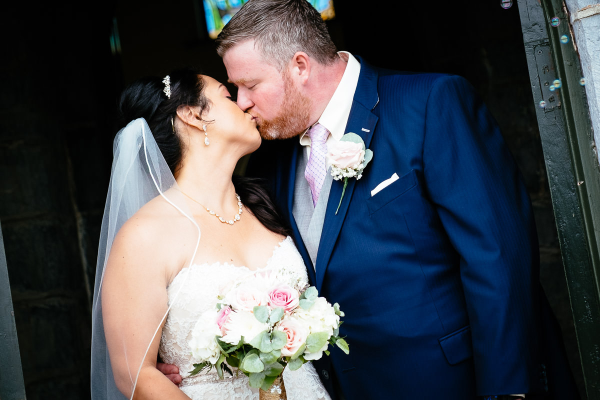 bride and groom embracing at gleno abbey hotel wedding