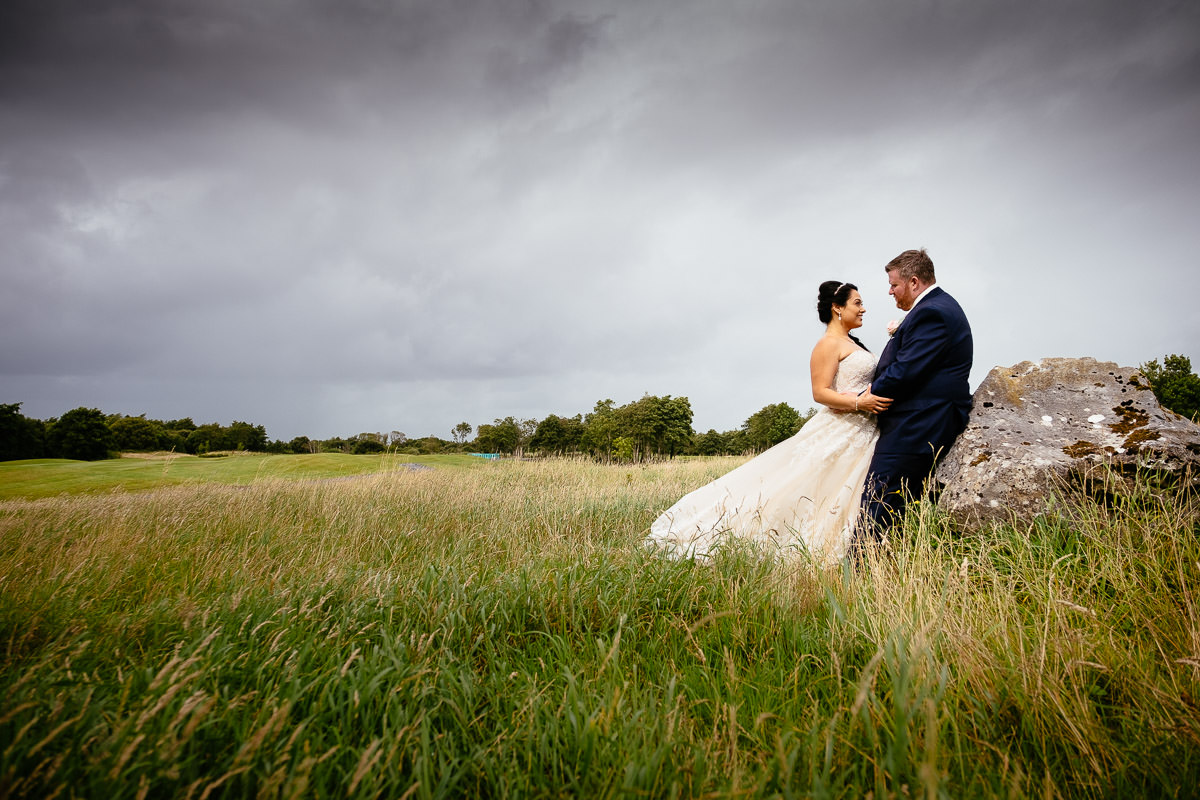 bride and groom embracing at gleno abbey hotel wedding