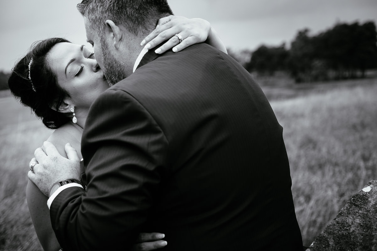 bride and groom embracing at gleno abbey hotel wedding