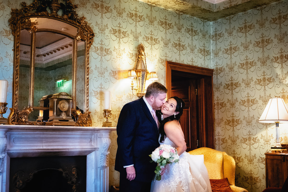 bride and groom embracing at gleno abbey hotel wedding