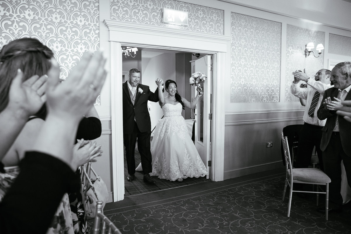 bride and groom entering function room at gleno abbey hotel wedding
