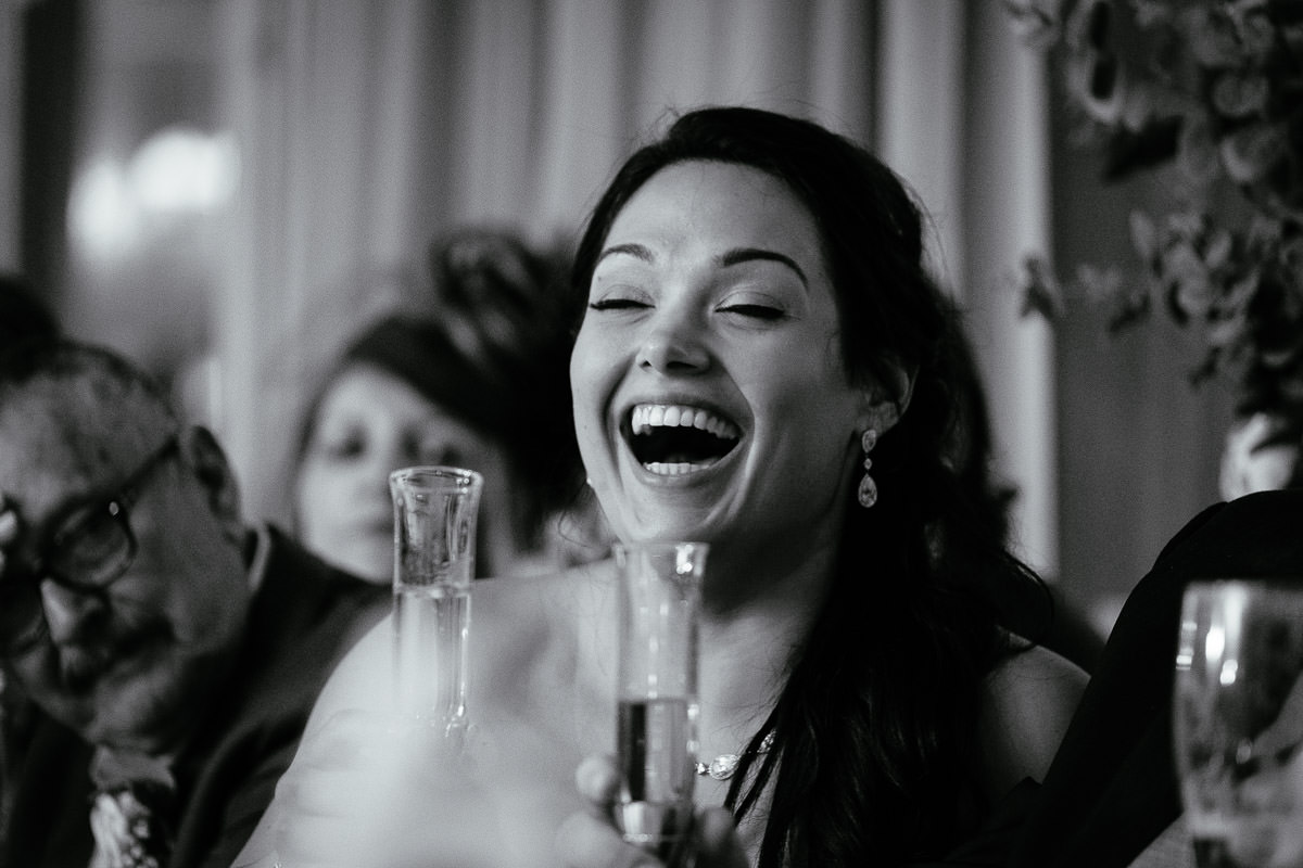 bride laughing during wedding speeches at glenlo abbey hotel