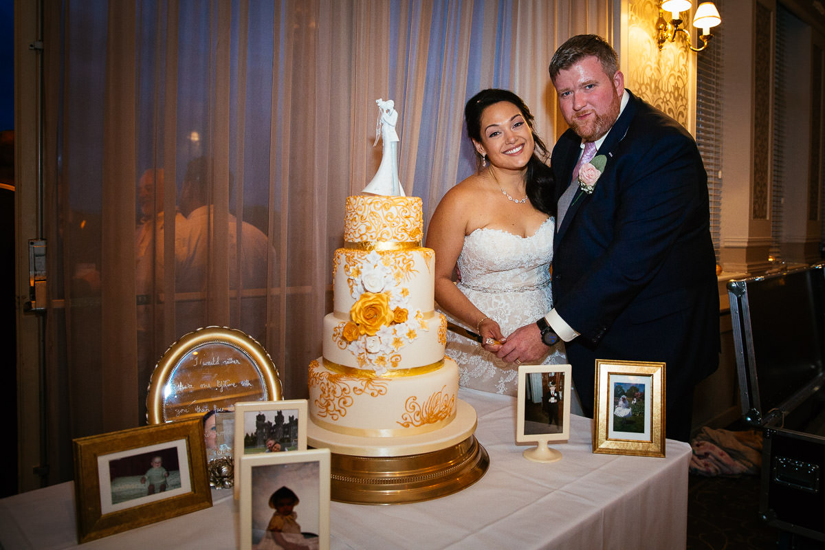cutting the wedding cake at glenlo abbey hotel