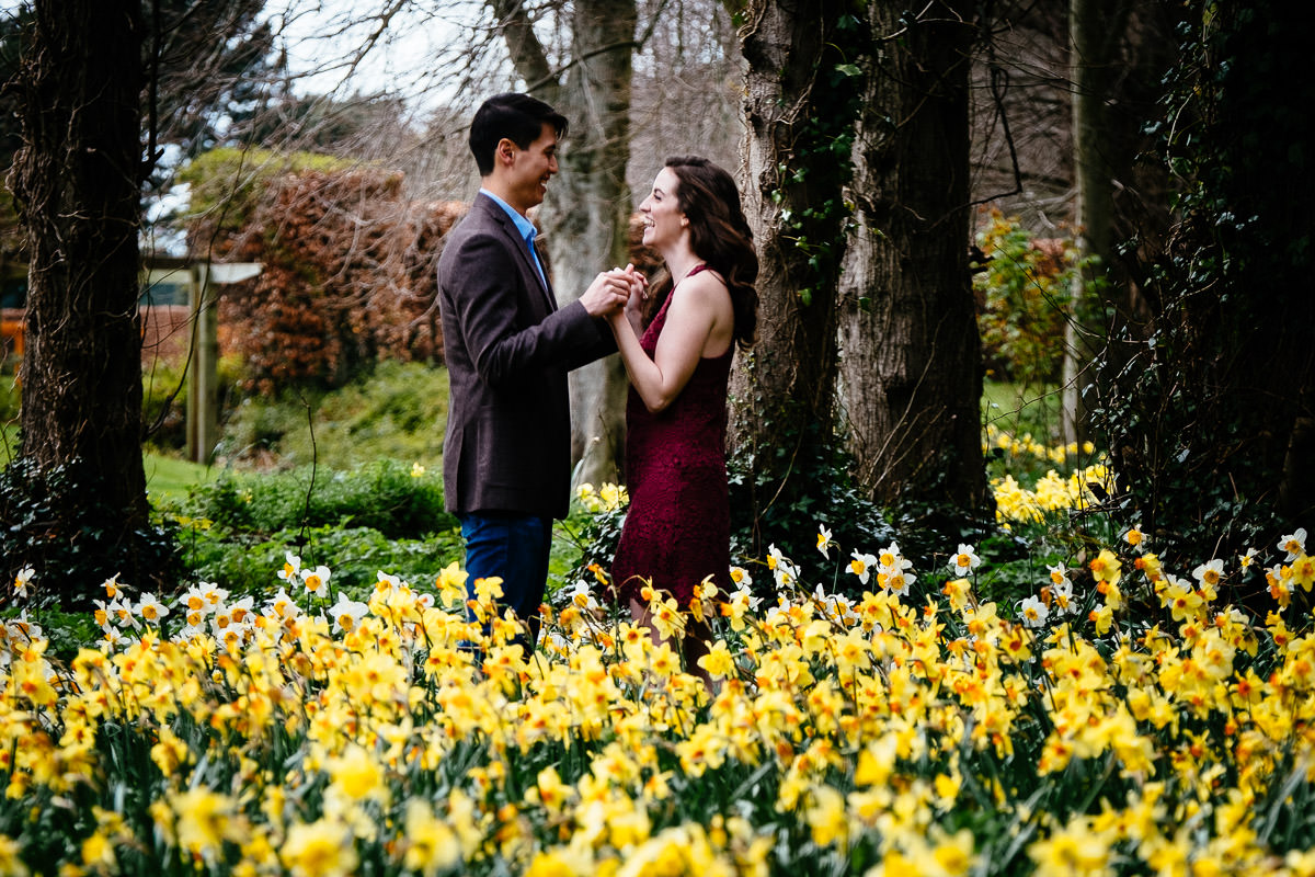 engaged couple holding hands in dublin park