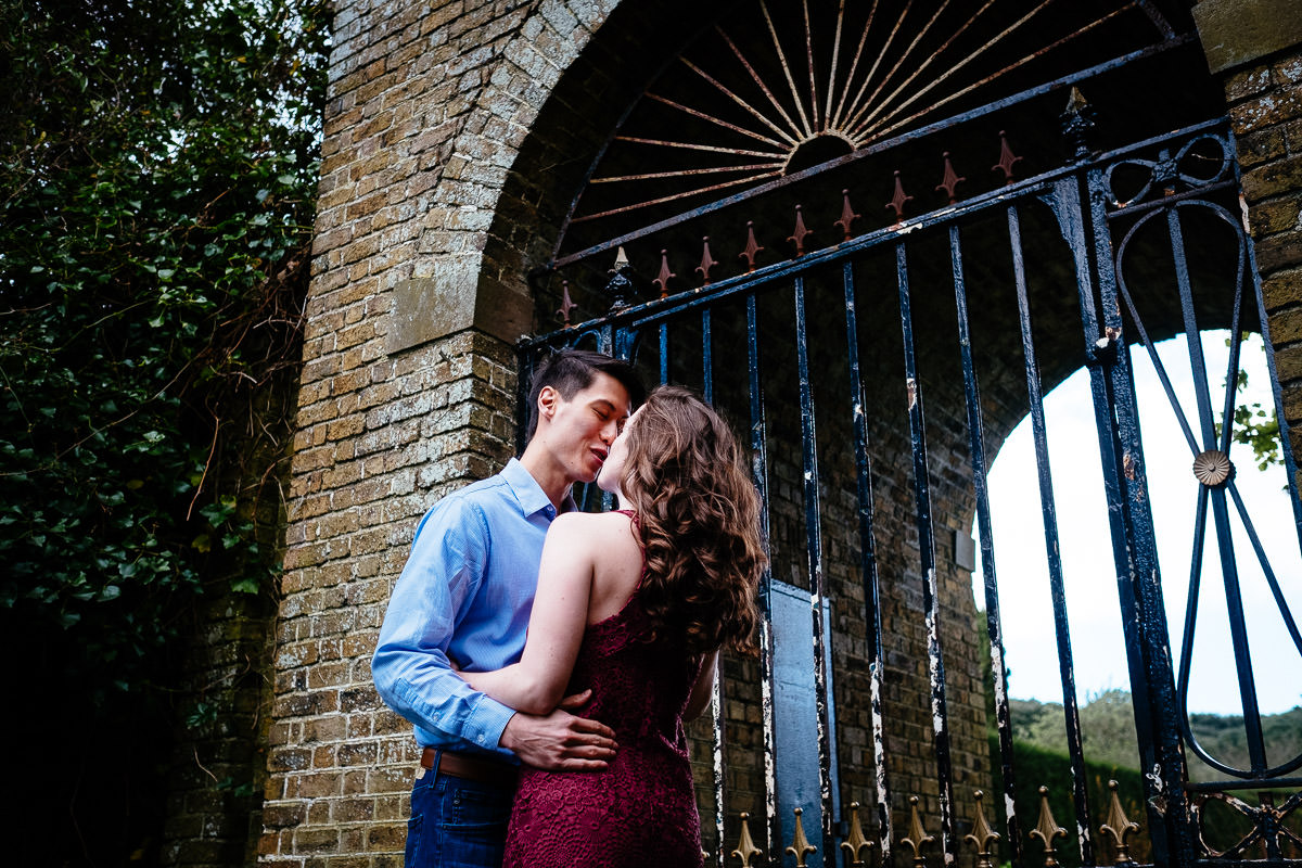 engaged couple kissing in dublin park