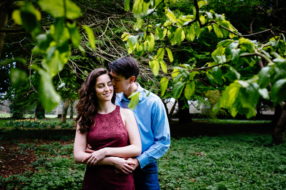 engaged couple hugging in st annes park