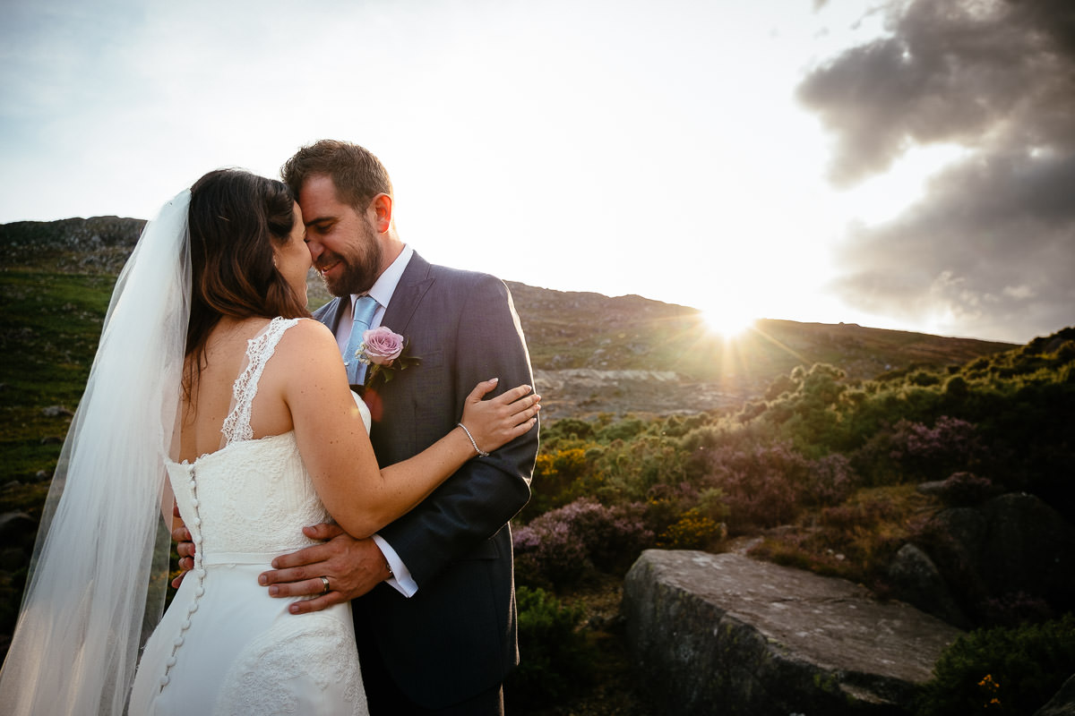 bride and groom at sunset in the wicklow mountains
