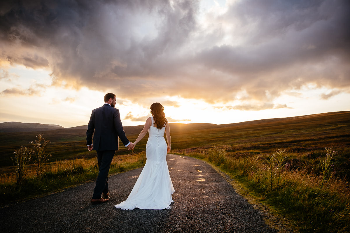 bride and groom at walking in the wicklow mountains