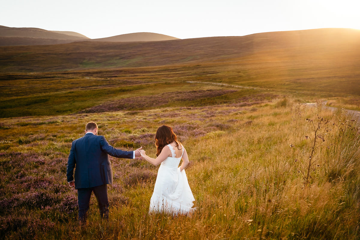 bride and groom at sunset in the wicklow mountains