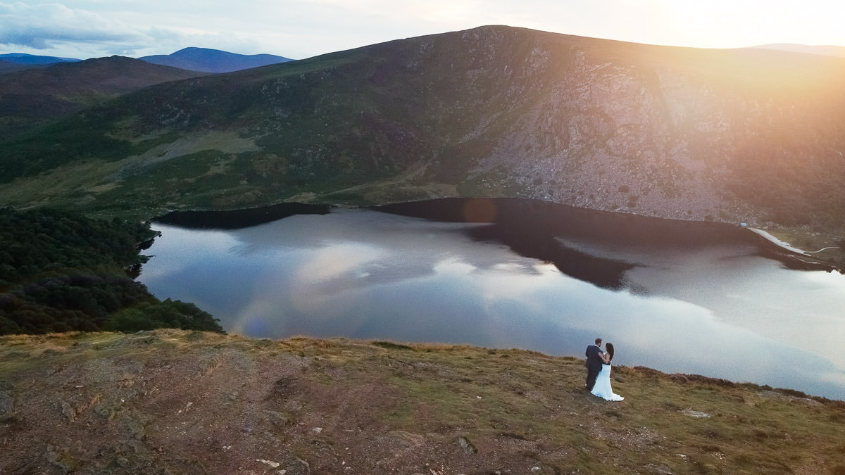 bride and groom at sunset at lough tay