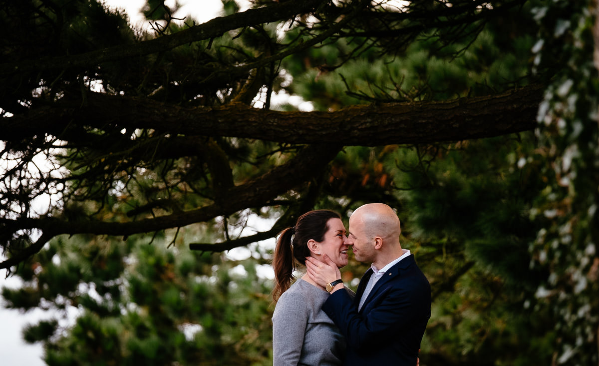 engaged couple kissing