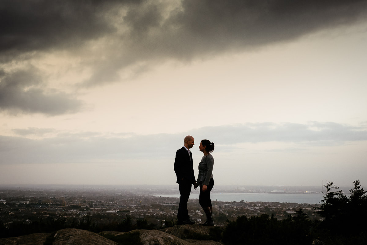 engaged couple with Dublin city in the background