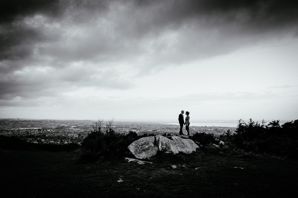 engaged couple with Dublin city in the background