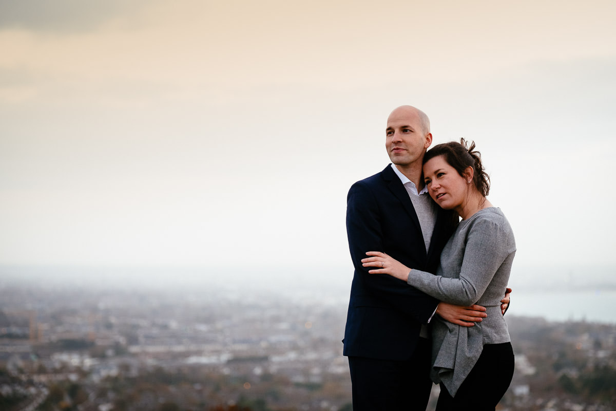 engaged couple with Dublin city in the background