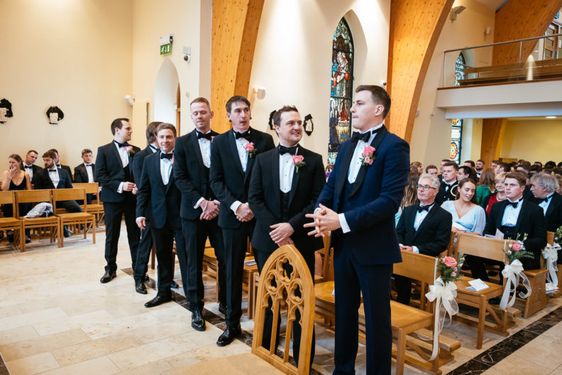 groom waiting for his bride to walk down the aisle