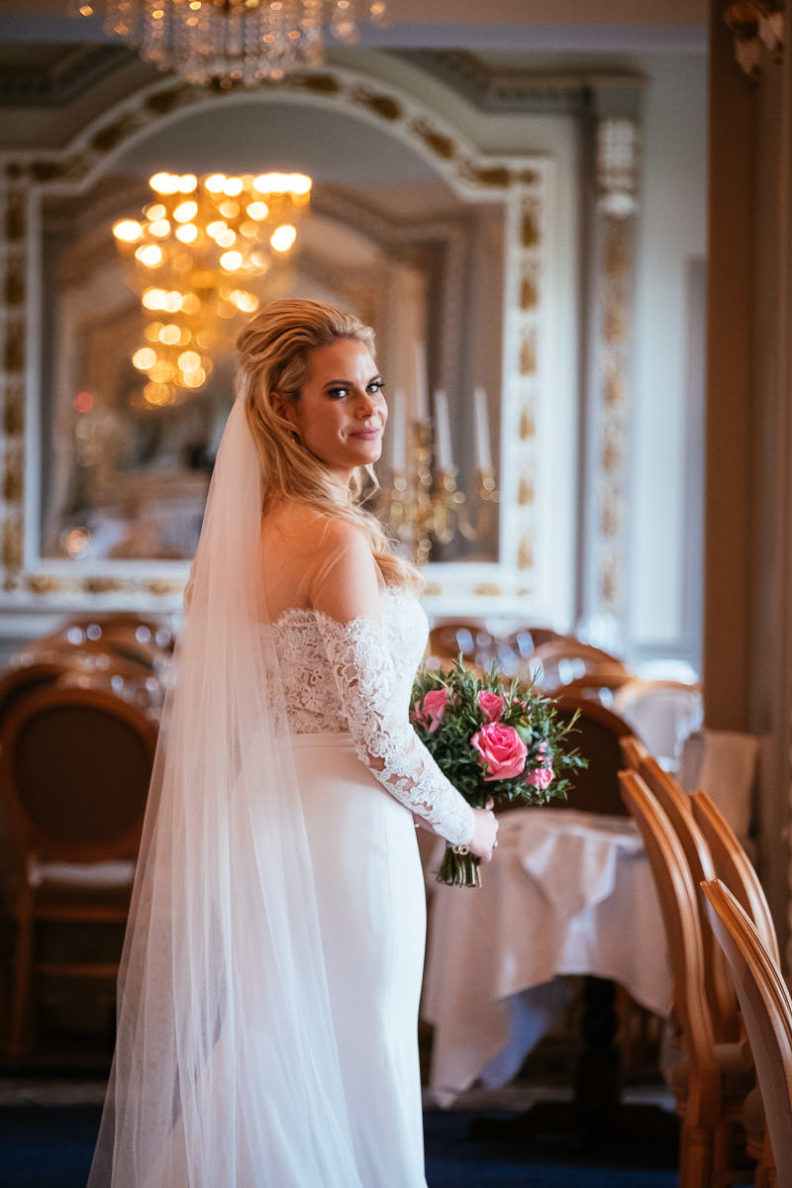 bride standing in the reception room of markree castle showing the back of her dress