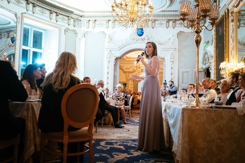 bridesmaid making a speech during wedding dinner