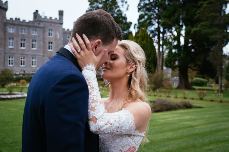Markree Castle Wedding Photographer 9 bride and groom kissing in front of an irish castle