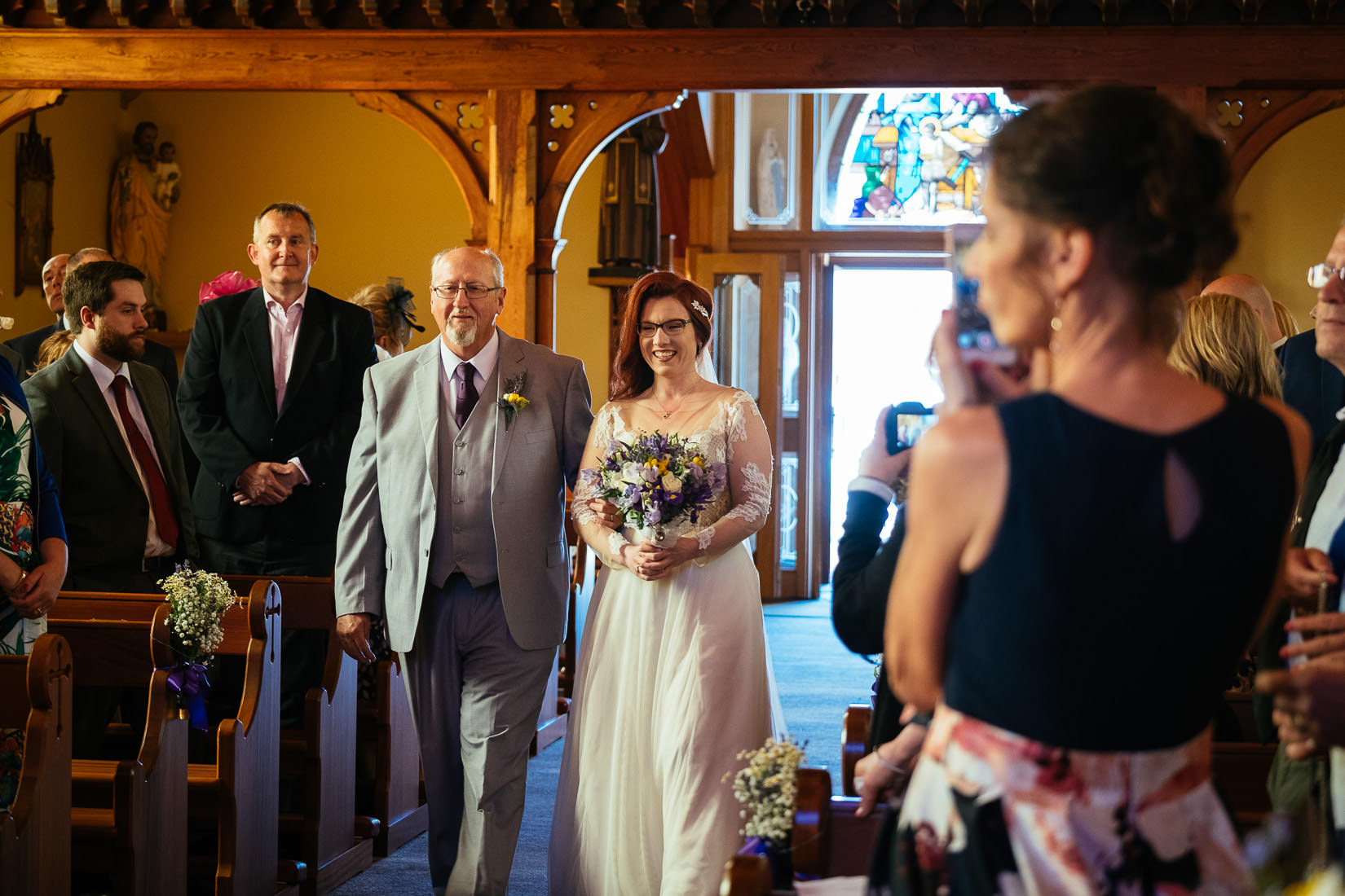 bride and her dad walking up the aisle