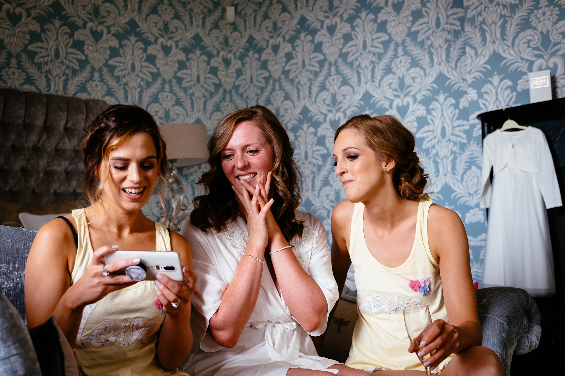 bride and bridesmaids laughing