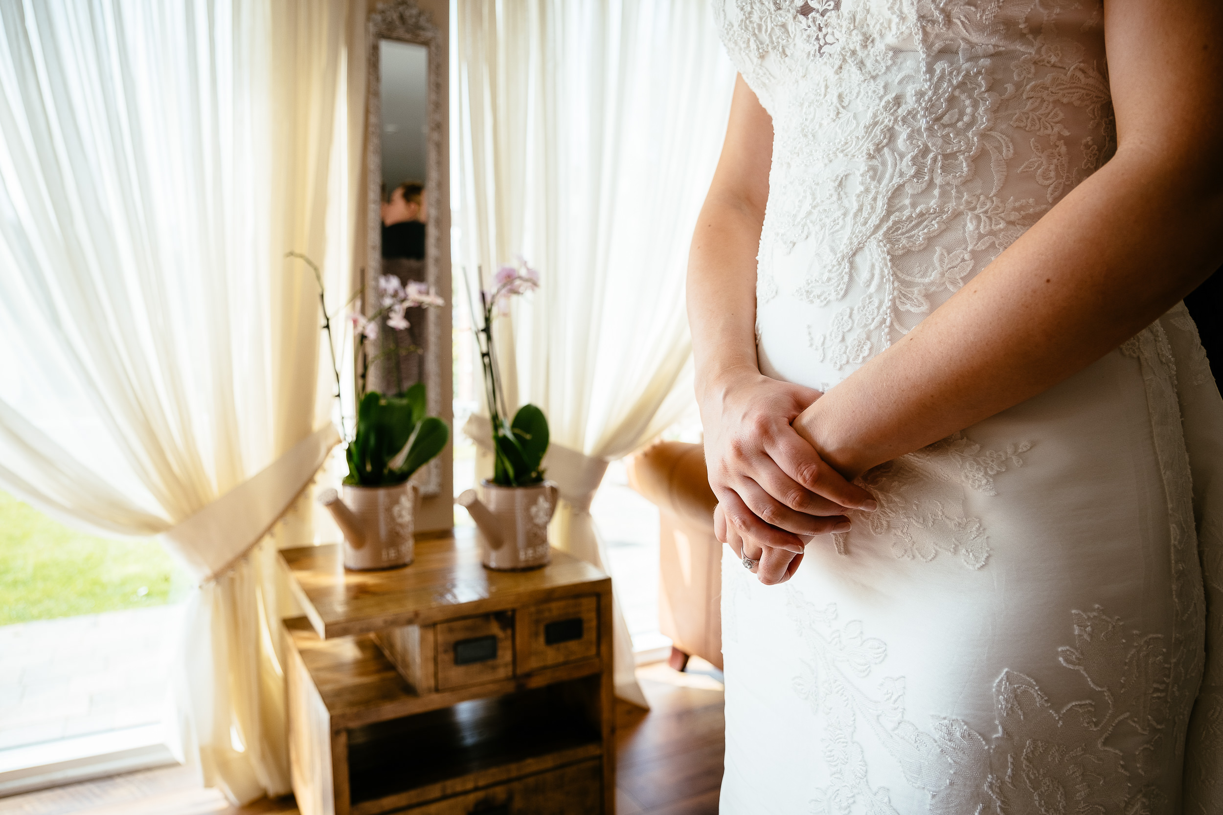 bride with her hands crossed on her lap