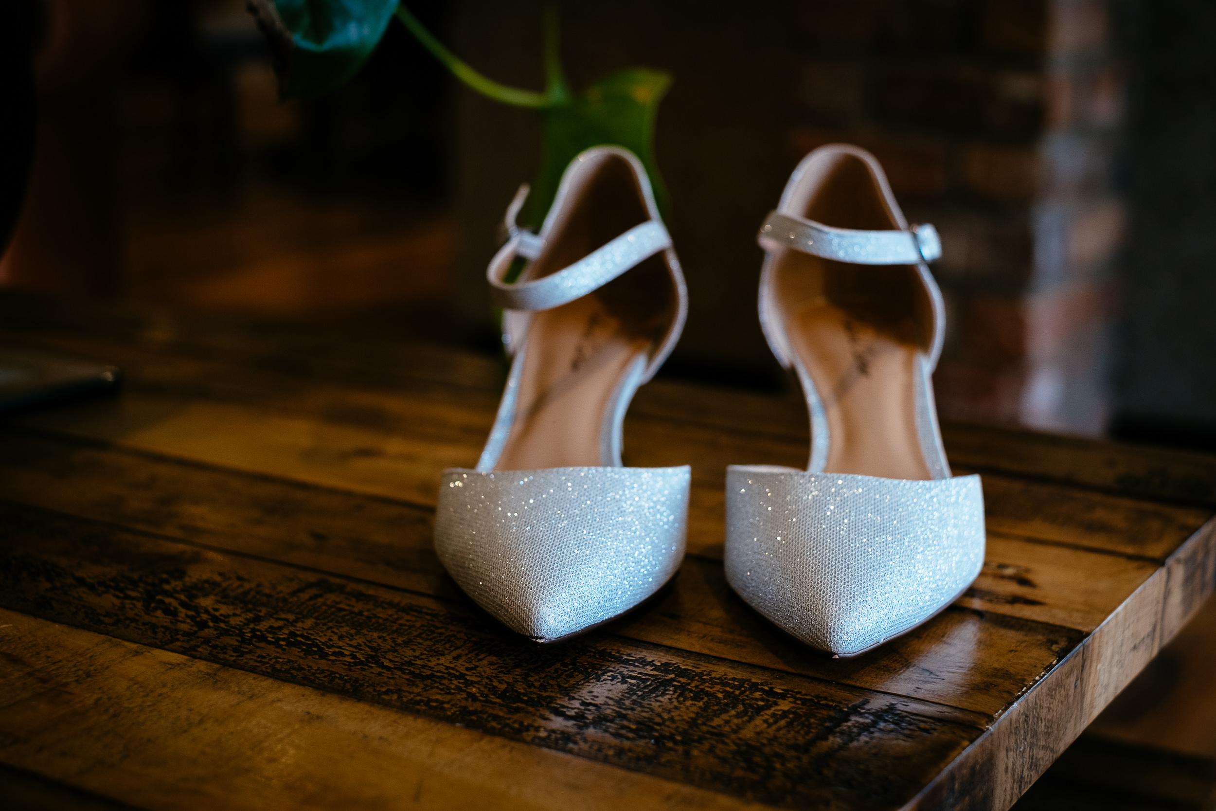 brides wedding shoes on a table
