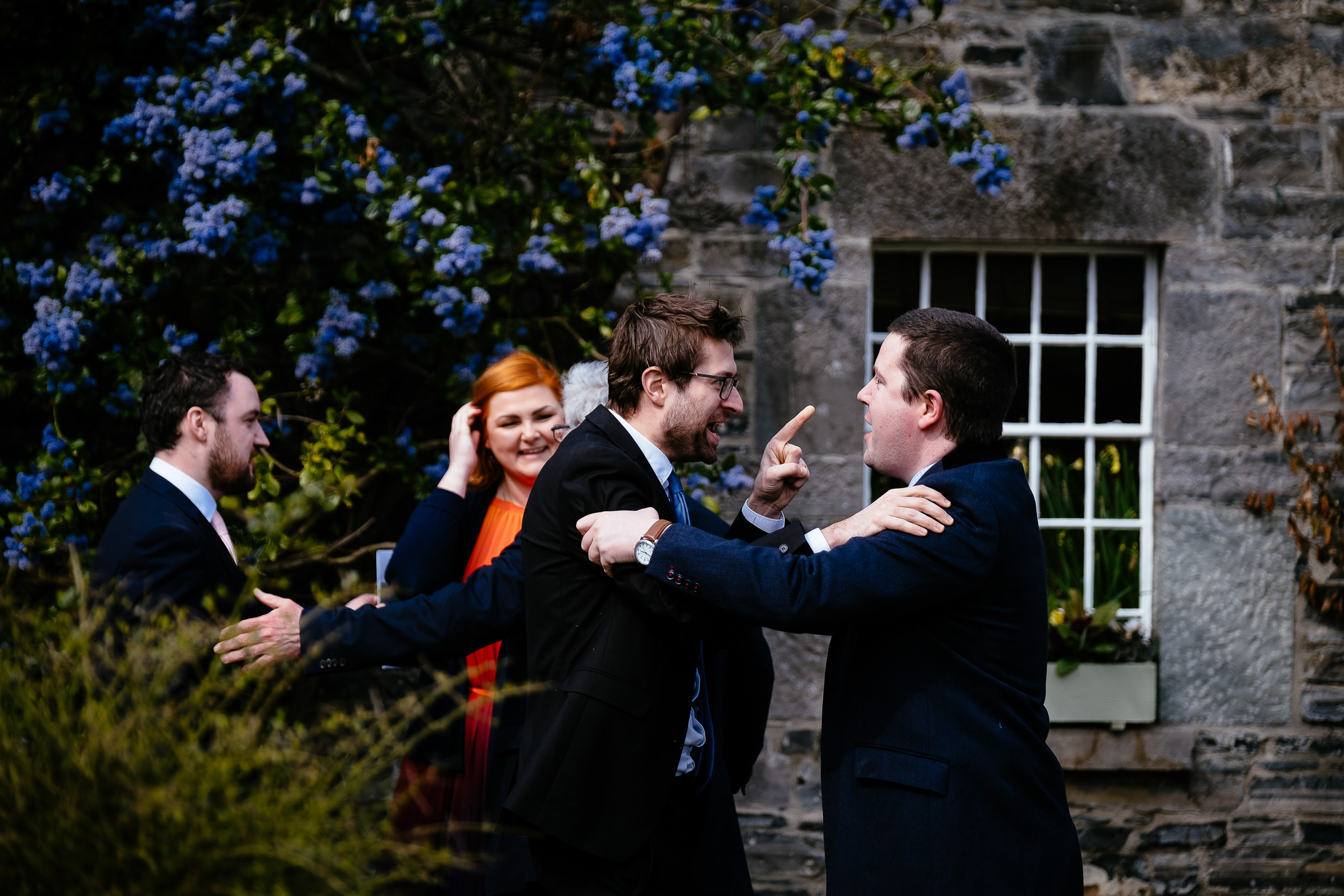guests greeting each other and laughing