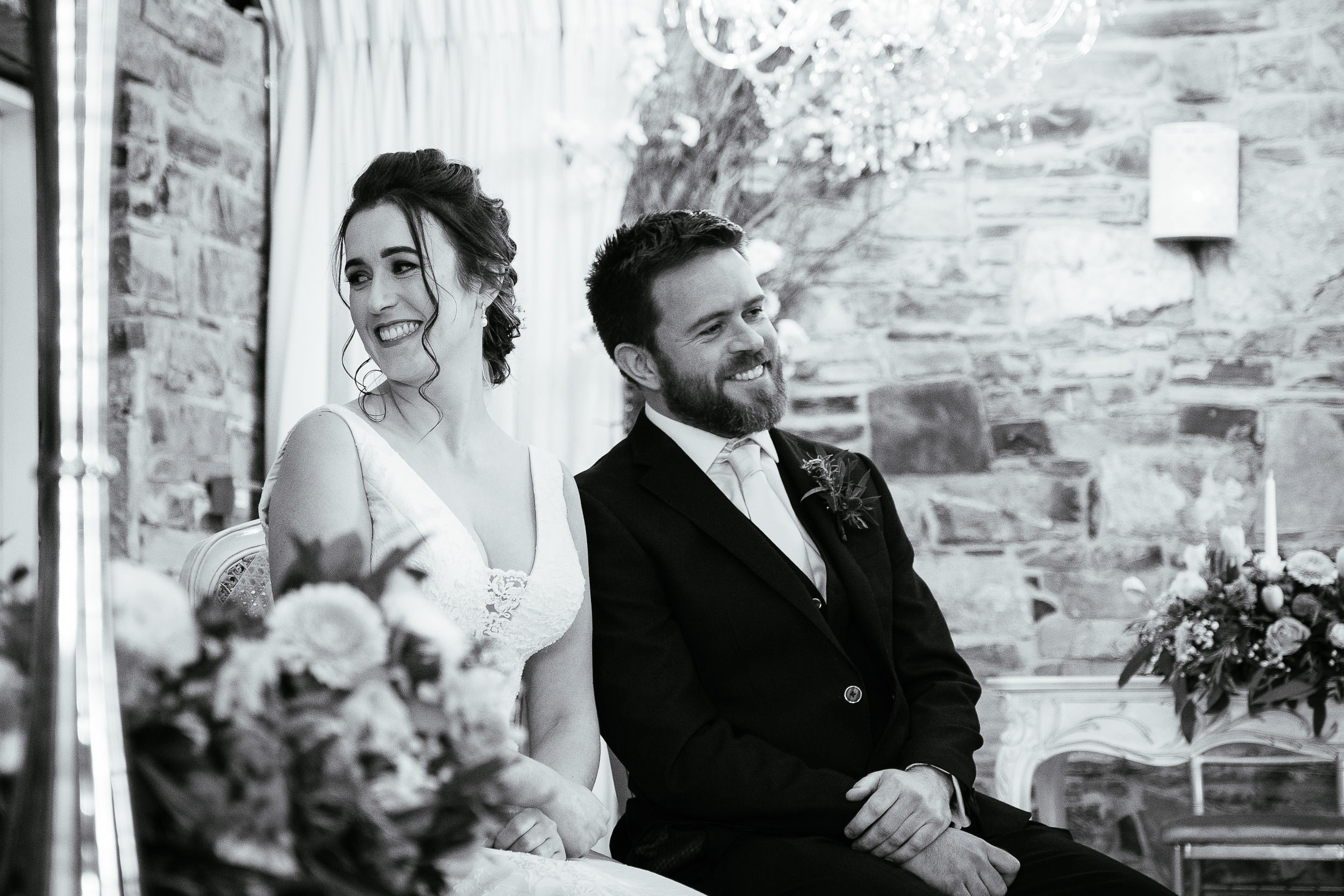 bride and groom laughing during wedding ceremony