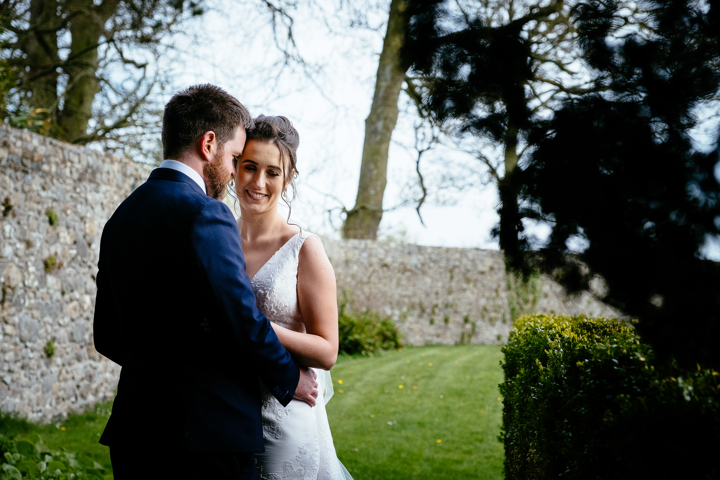 bride and groom snuggling