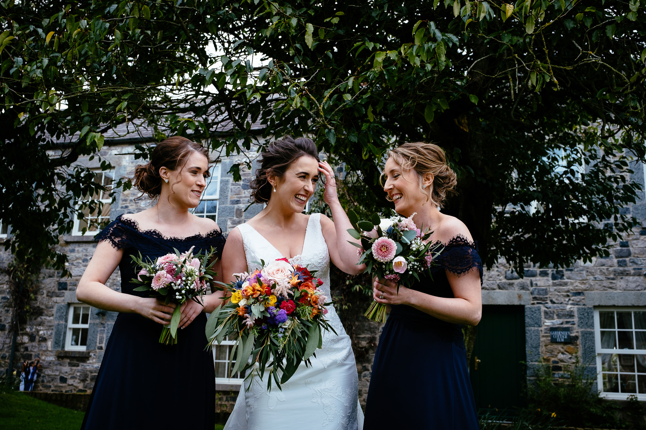 bride laughing with bridesmaids at Ballymagarvey village meath