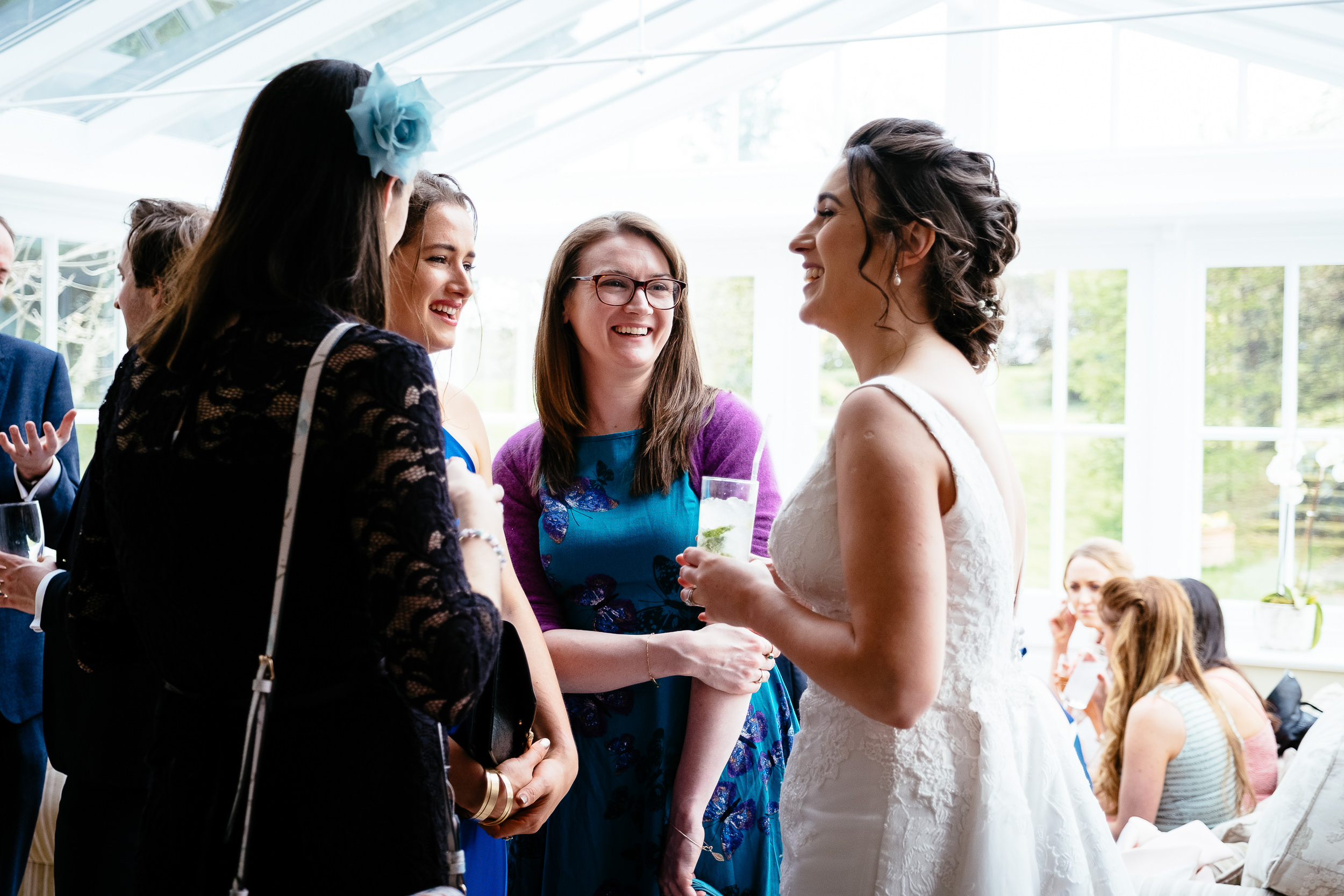 guests laughing with bride