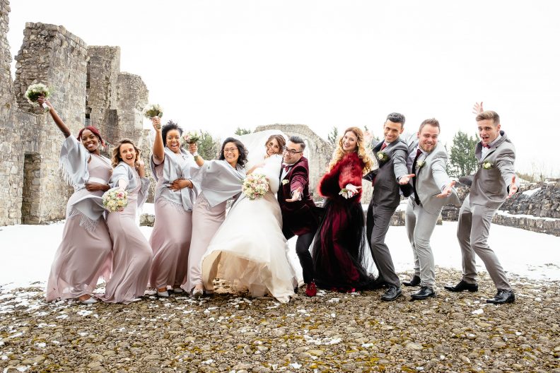 Winter Wedding in Ireland 14 bridal party laughing and joking in the snow at a winter wedding in ireland