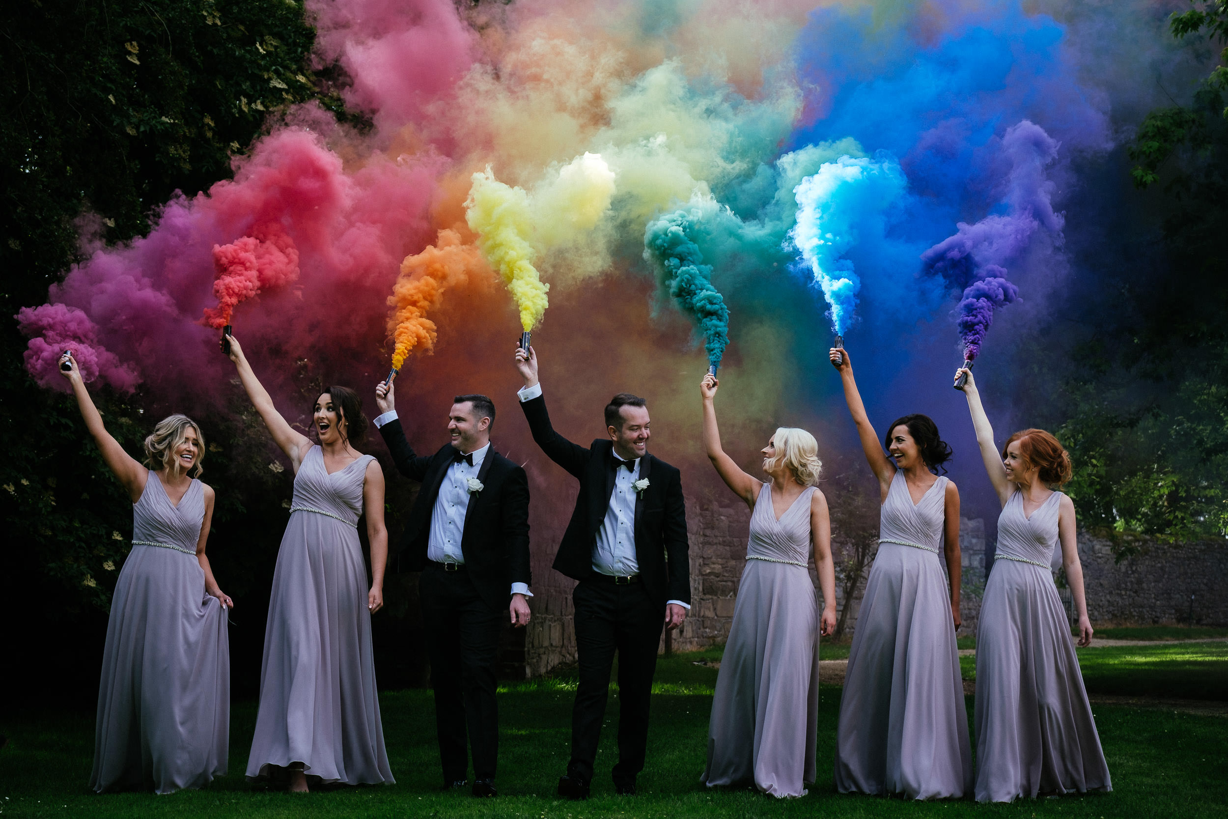 bridal party holding smoke bombs at Johnstown House estate wedding
