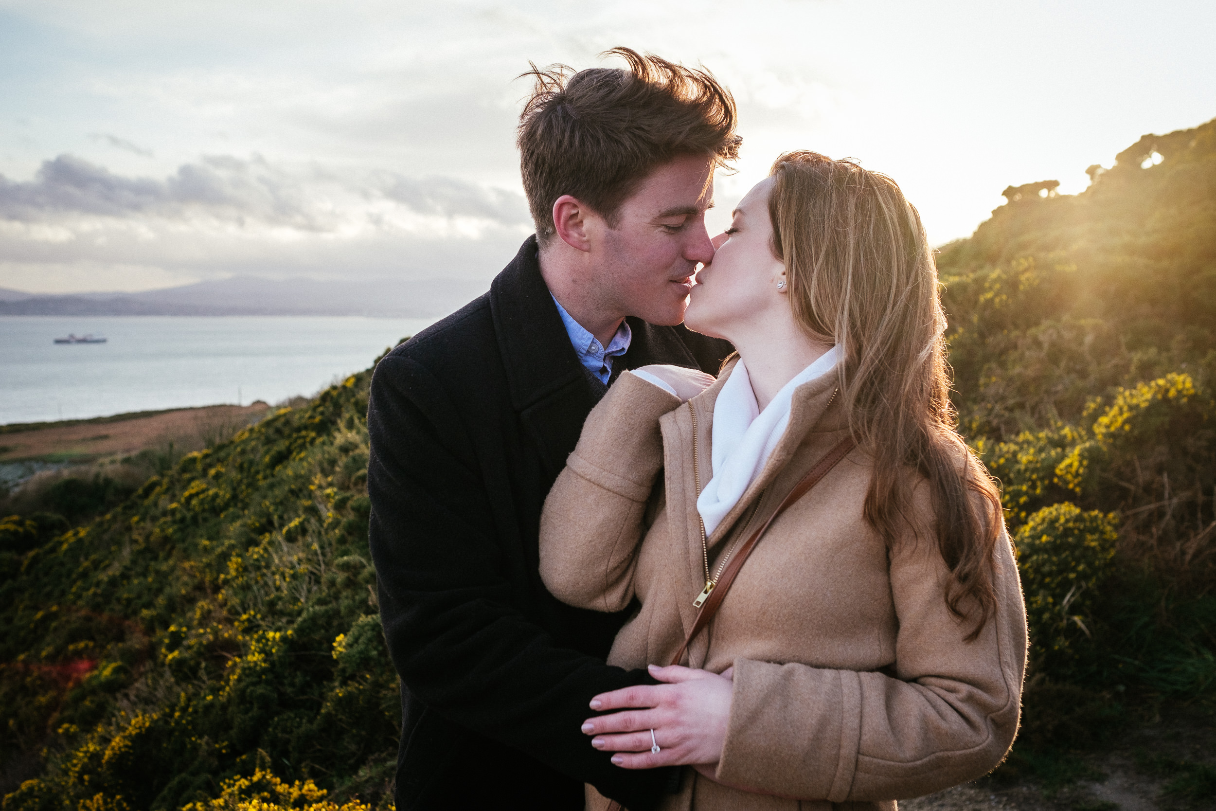 couple kissing after proposing at Howth Head Dublin
