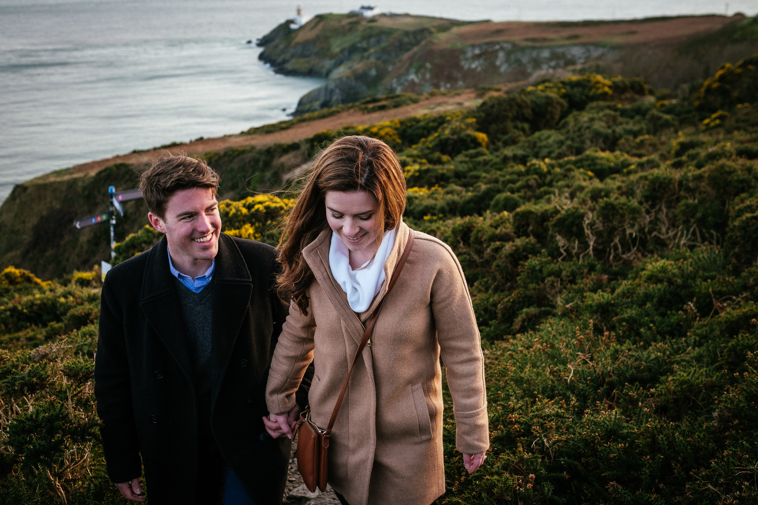 couple walking up steps on the cliff path at howth summit dublin